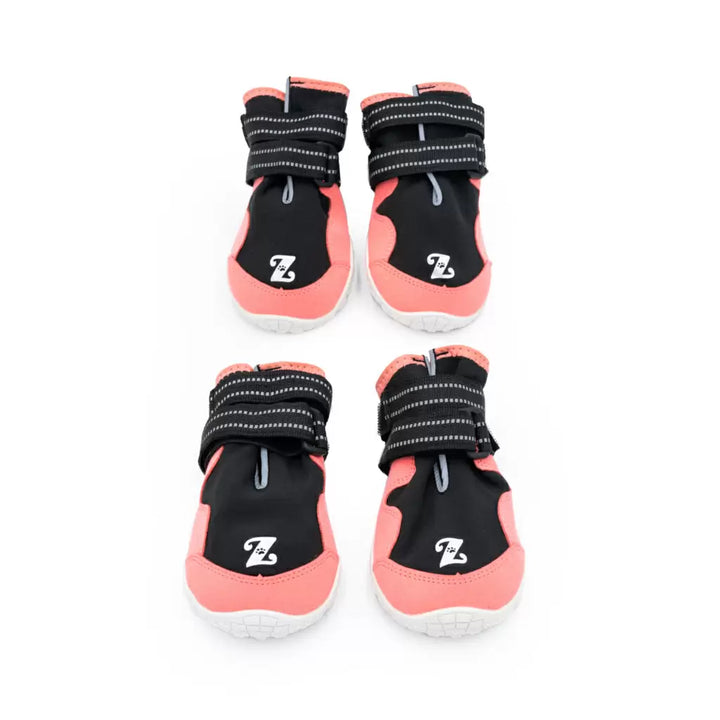 Set of four pink and black dog boots with white tread