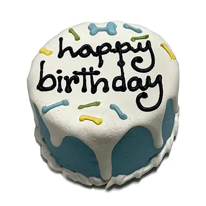 Small round birthday cake with 'happy birthday' text on a white background