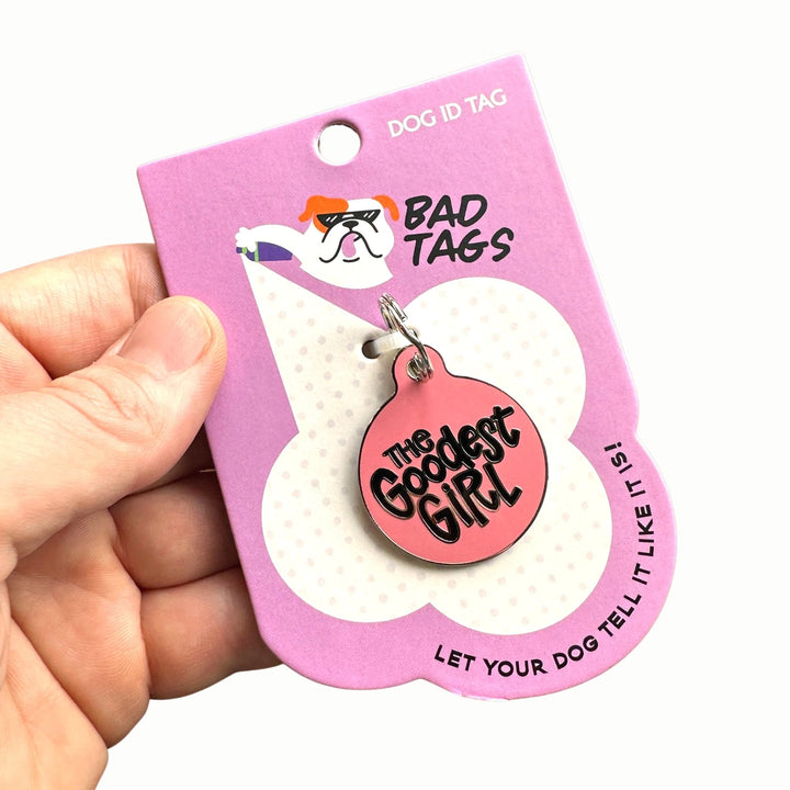 Dog ID tag with 'The Goodest Girl' on a pink 'Bad Tags' packaging