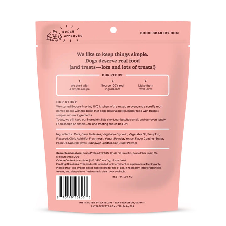 Back of a pink Bucci Bakery dog treat pouch, showing product details, ingredients, barcode, and shipping information on a white background.