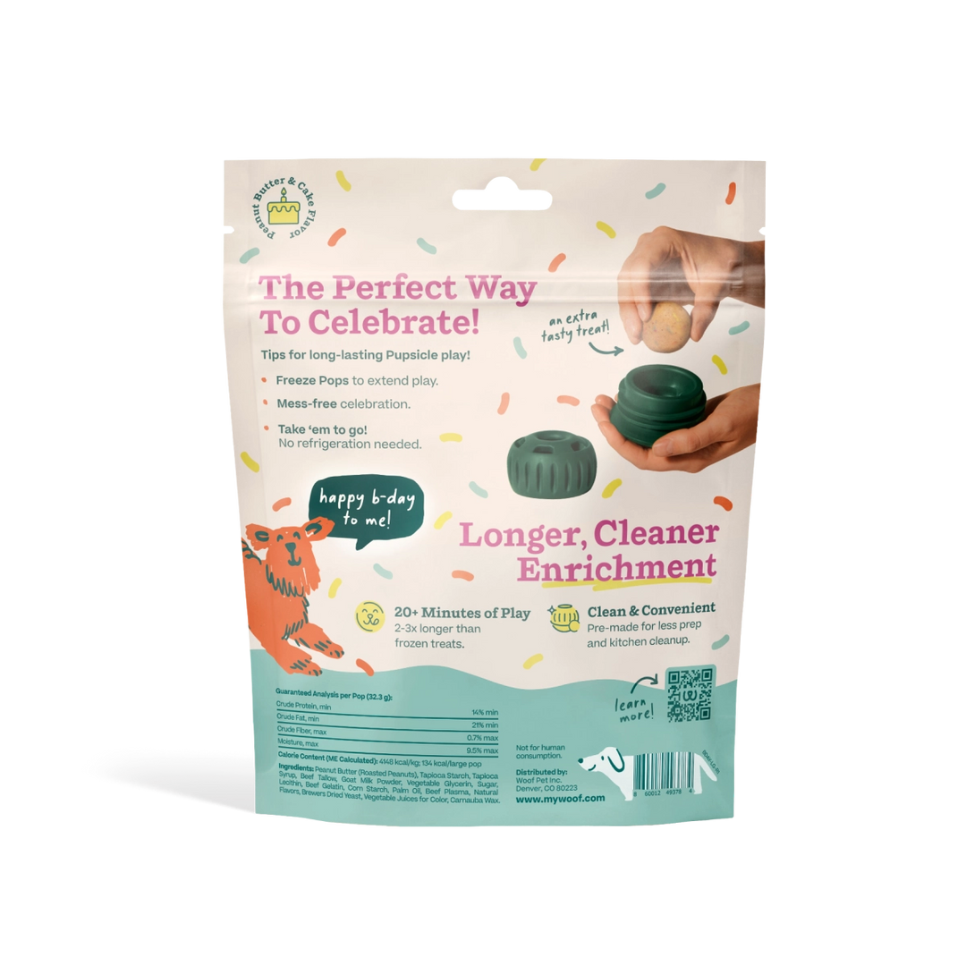 A stand-up pouch of Pet Playz Longer, Cleaner Enrichment popsicle play ice for dogs, shown against a plain white background. The packaging is cream and teal with colorful confetti accents, featuring instructions, a tiger illustration, and a demonstration of the green and dark green plastic popsicle pieces held by a hand.