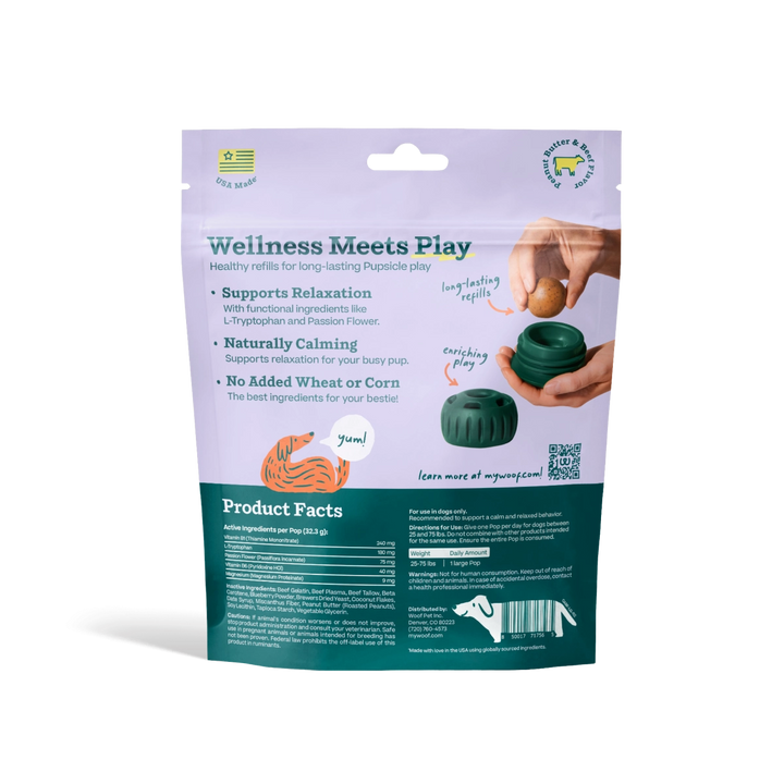 A stand-up pouch of pet chew treats on a white background. The packaging is lavender on top and dark teal on the bottom, with text reading 'Wellness Meets Play' and product facts.