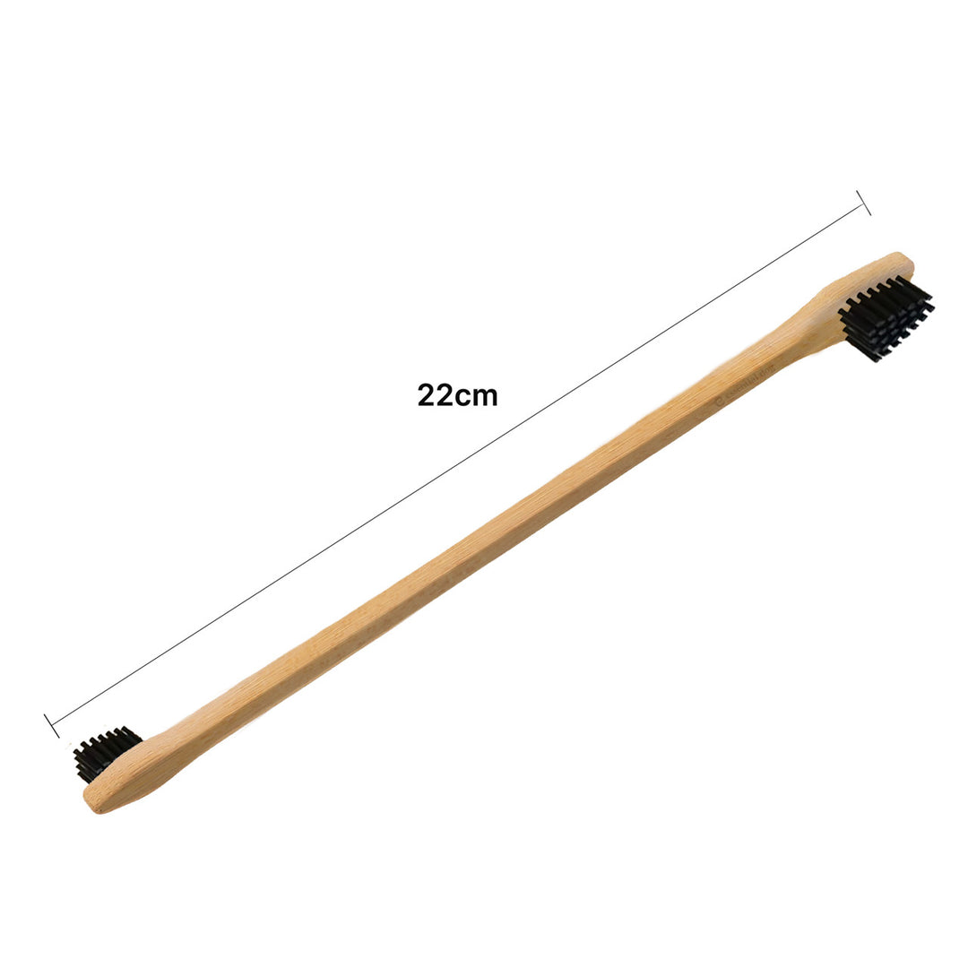Bamboo toothbrush with black bristles and measurement label on a white background