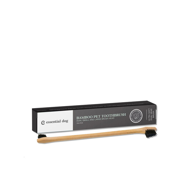 Bamboo pet toothbrush with packaging on a white background
