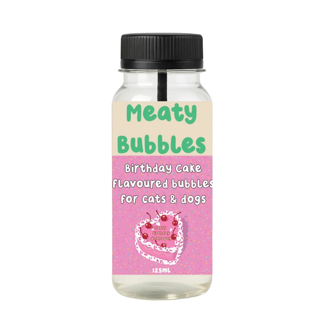 Bottle of 'Meaty Bubbles' birthday cake flavored bubbles for cats and dogs on a white background