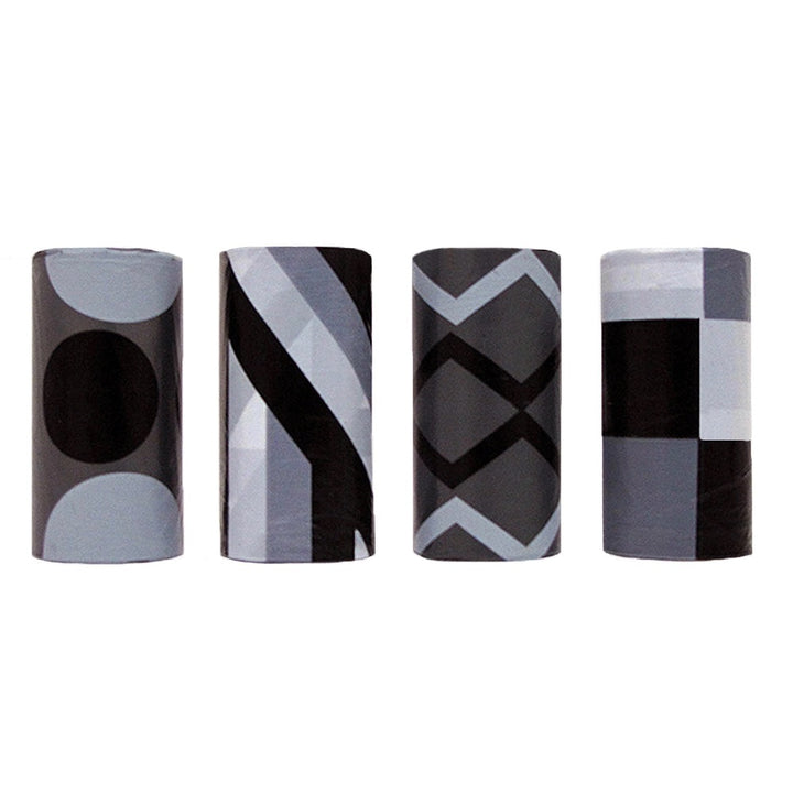 Four cylindrical containers with geometric patterned designs on a white background