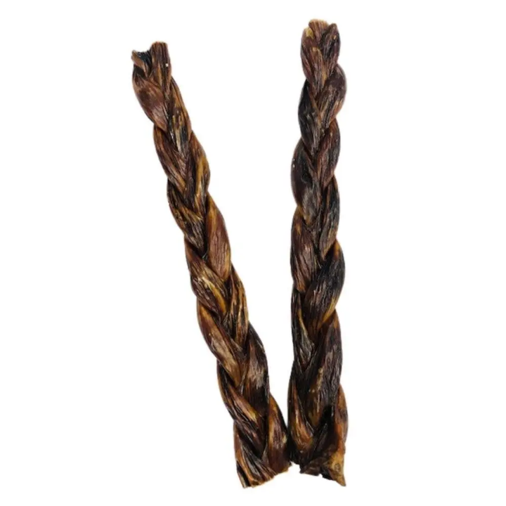 Two braided dog treats on a white background