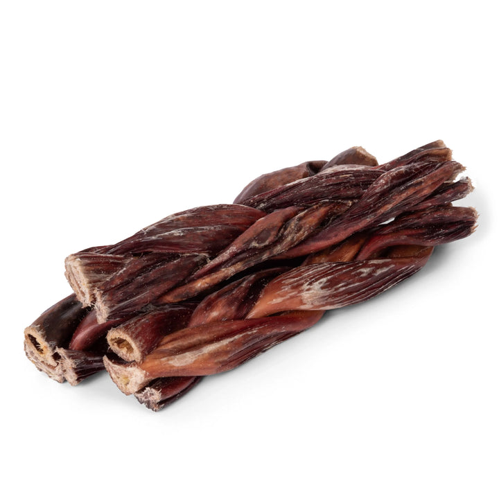 Bundle of dried beef jerky sticks on a white background