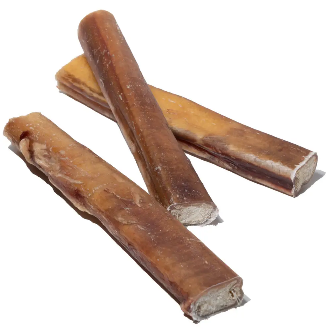 Three brown dog chew treats on a white background