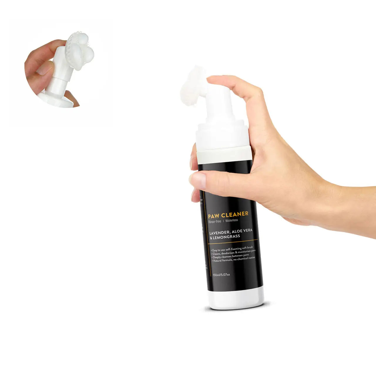 Paw cleaner bottle with black label held by a hand on a white background