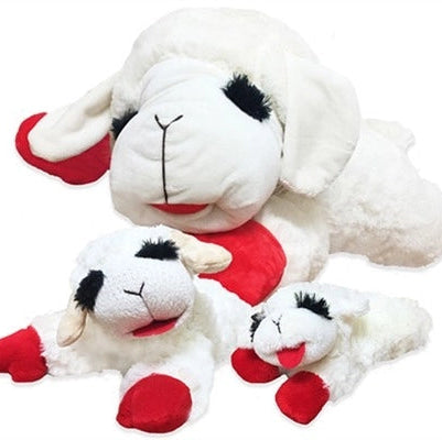 Set of three white plush sheep with red shoes on a white background