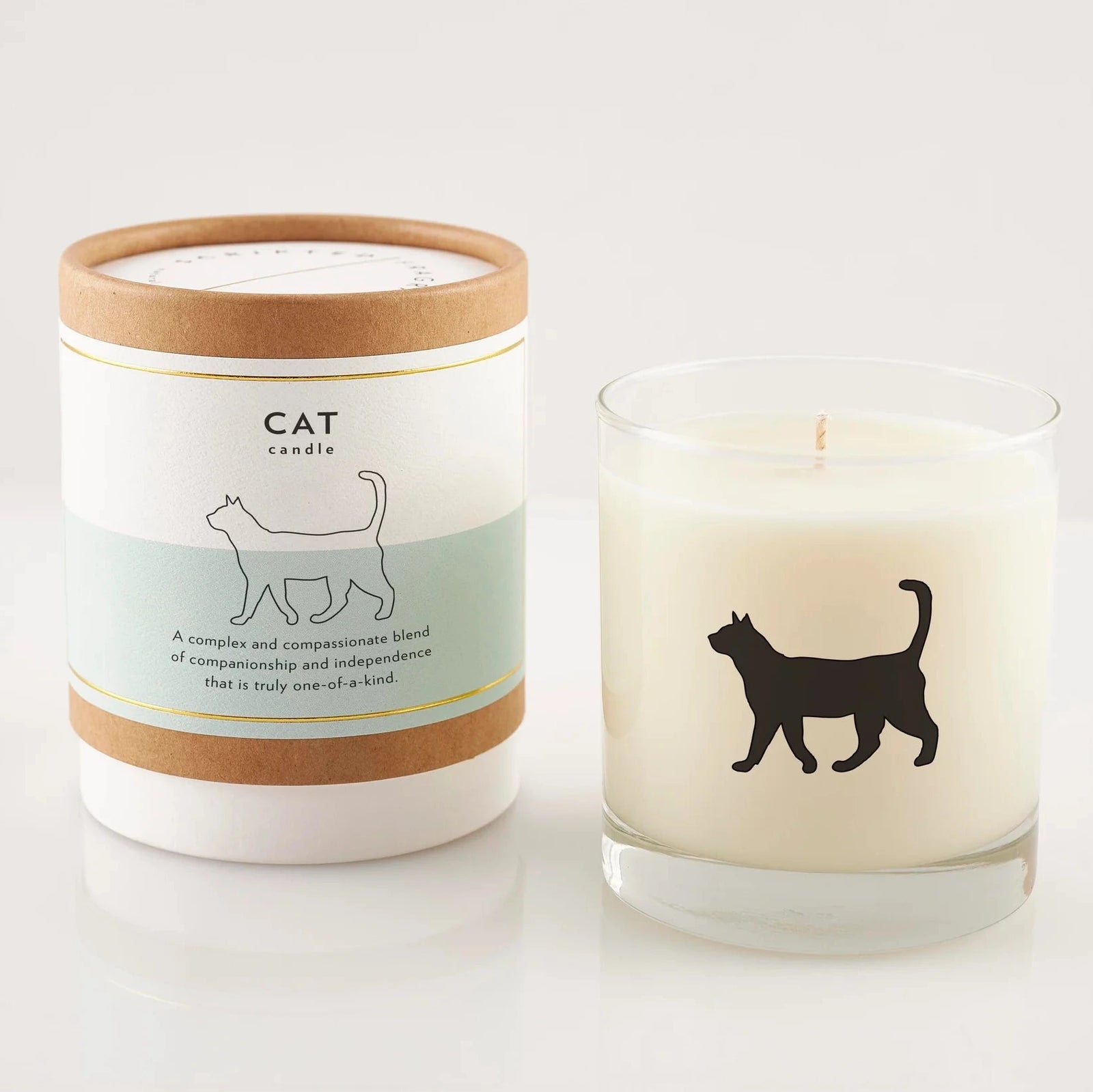 Cat-themed candle with a matching container on a white background