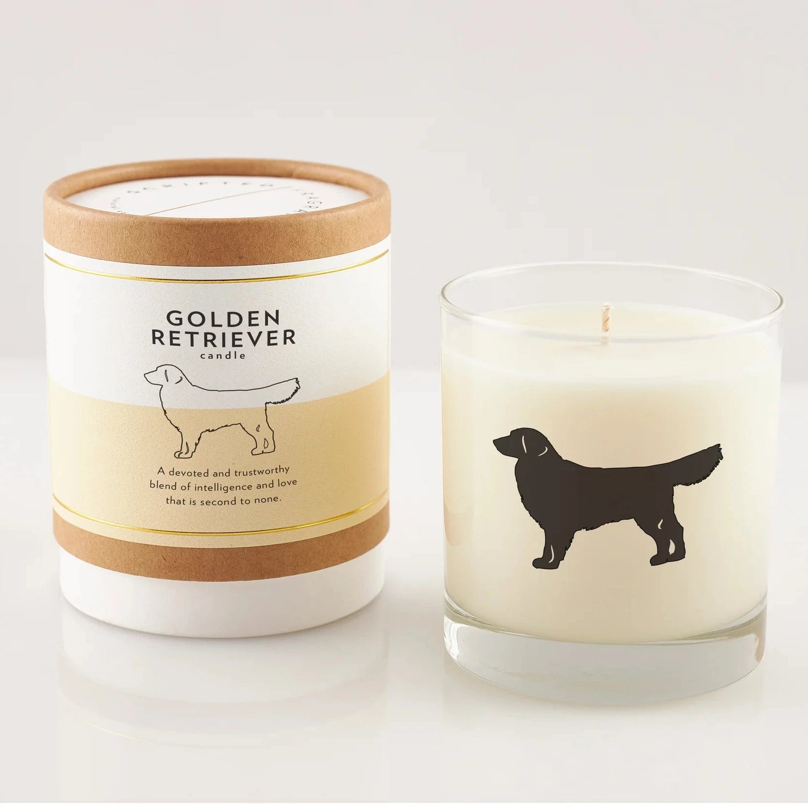 Candle with a Golden Retriever design and matching packaging on a white background