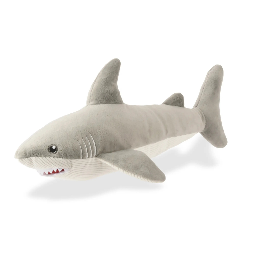 Blue plush whale toy on a white background