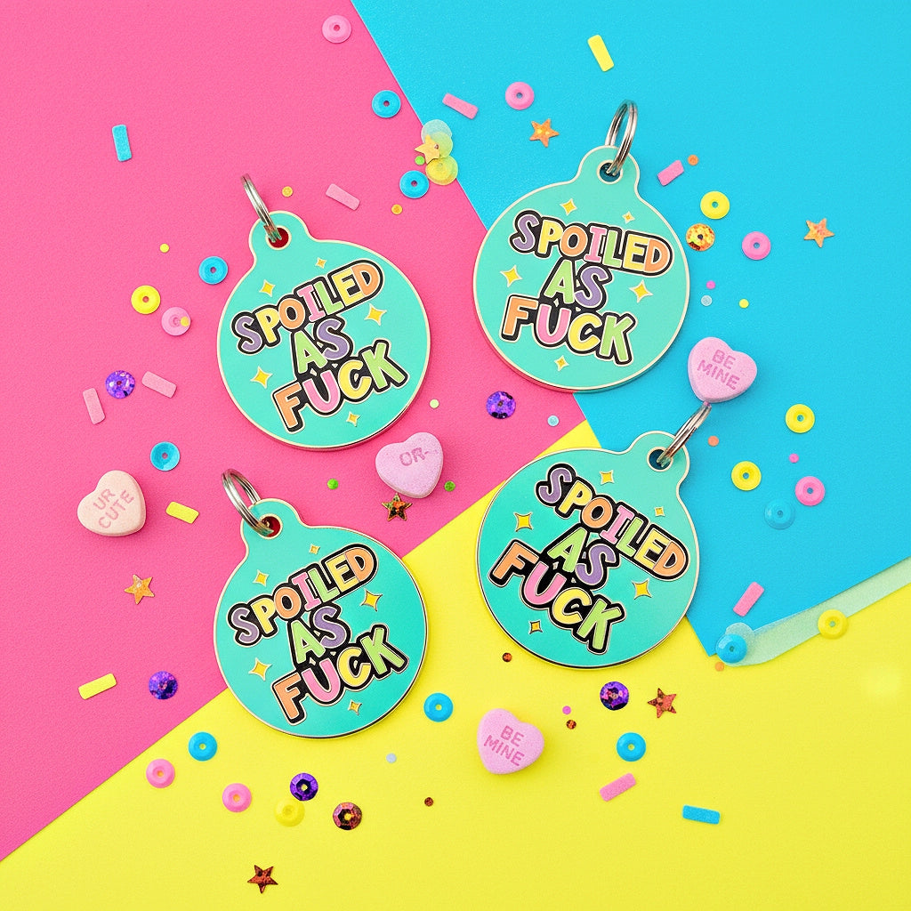Four round turquoise tags with 'Spoiled as Fuck' text on a colorful background