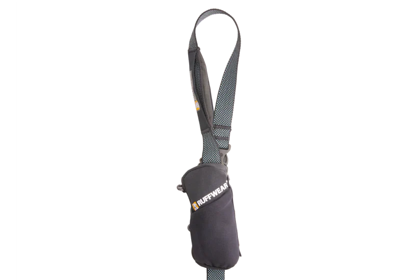 Dog poop bag dispenser with a strap on a white background