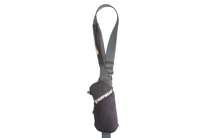 Dog poop bag dispenser with a strap on a white background