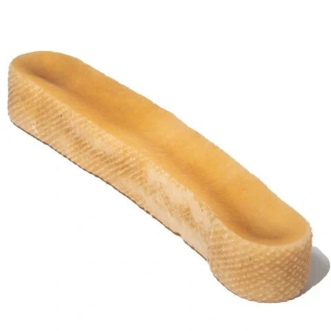 Himalayan yak cheese chew stacked on a white background