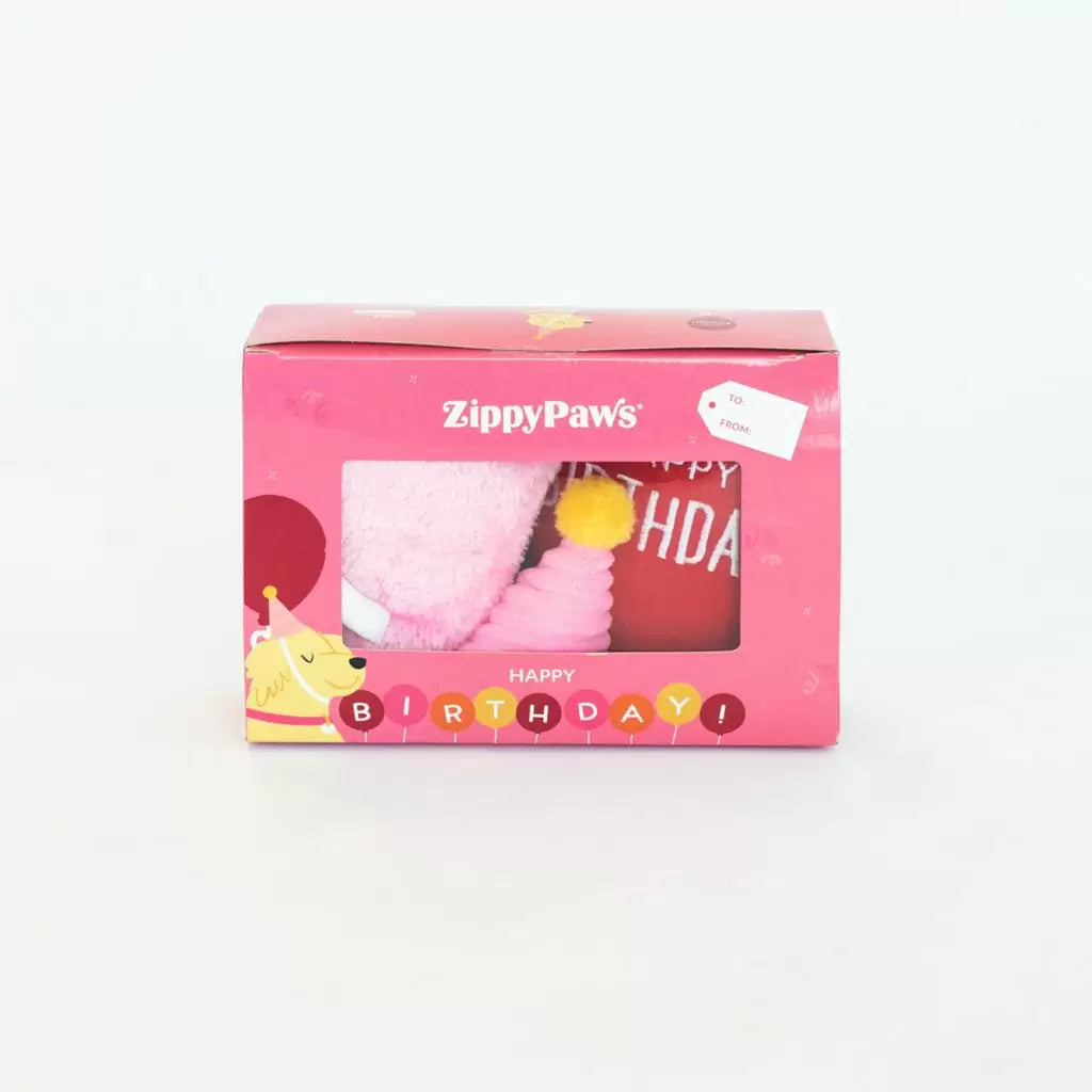 Pink ZippyPaws birthday-themed packaging on a white background
