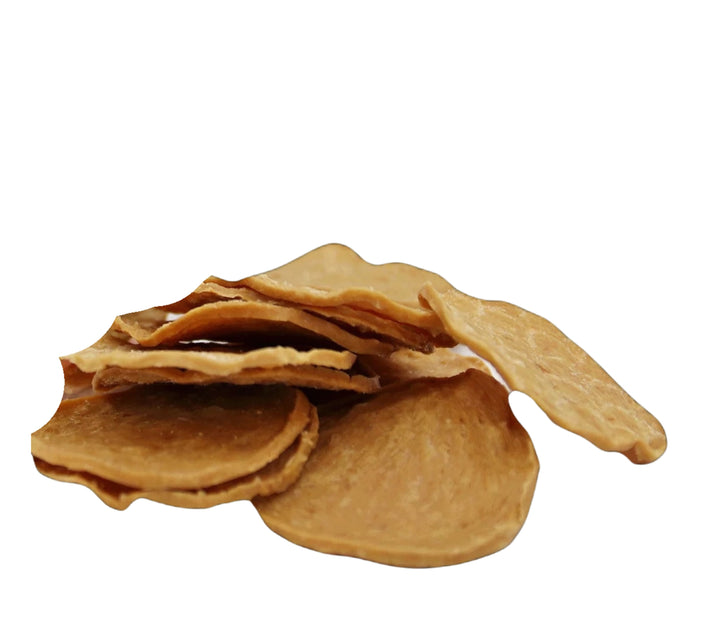Stack of thin, crispy brown tortilla chips on a white background