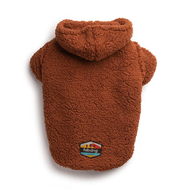 Brown fleece dog coat with a colorful label on a white background